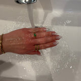 Rachel-ring med gröna zirkoniastenar