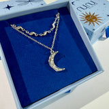 Titaniahalsband med hamrat månhänge